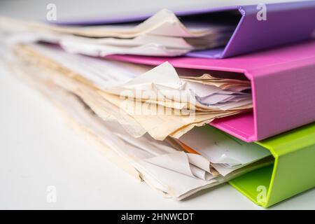 File Folder Binder stack of multi color on table in office. Stock Photo