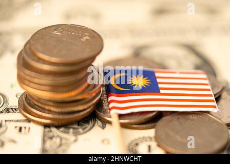 Malaysia Flag on coins background, Business and finance concept. Stock Photo