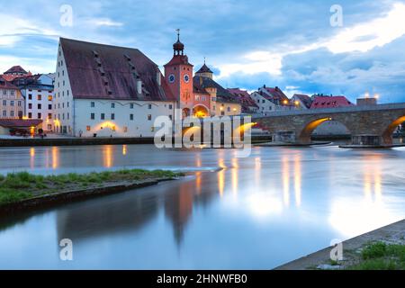 Night Stone Bridge and Old Town of Regensburg, Bavaria, Germany Stock Photo