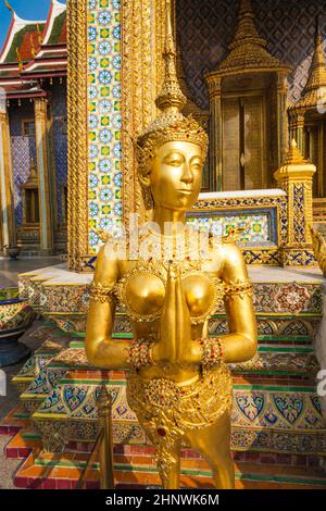 a kinaree, a mythology figure, is watching the temple in the Grand Palace Stock Photo