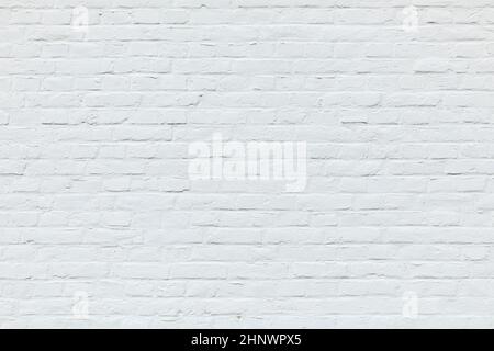 old white brick wall painted in white as harmonic background Stock Photo