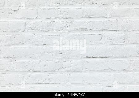 old white brick wall painted in white as harmonic background Stock Photo