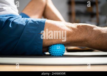 Leg Massage With Trigger Point Spiky Massage Ball. Myofascial Release Stock Photo