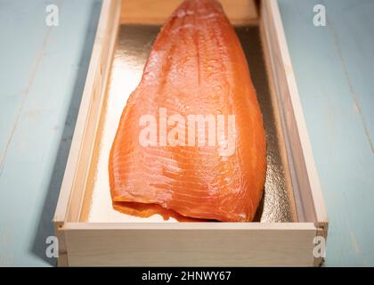 Smoked wild sockeye salmon inside wooden box Stock Photo