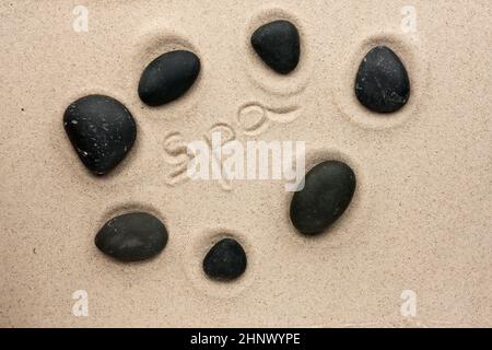 Word Wellness written on a stone background with a daisy Stock Photo - Alamy