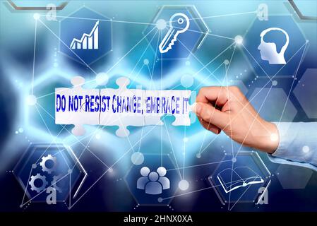 Writing displaying text Do Not Resist Change Embrace It, Business overview Be open to changes try new things Positive Hand Holding Jigsaw Puzzle Piece Stock Photo