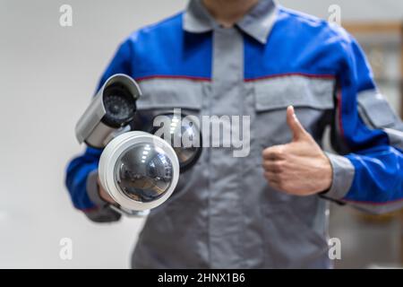 Technician Using Surveillance Security Camera Video System Stock Photo