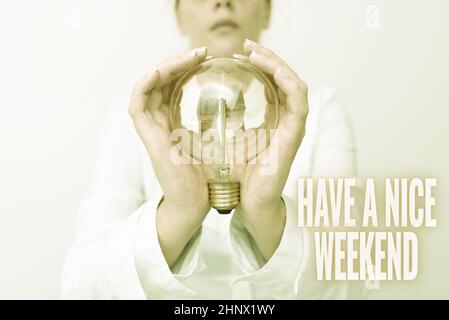 Text sign showing Have A Nice Weekend, Business overview wishing someone that something nice happen holiday Lady in outfit holding lamp with two hands Stock Photo