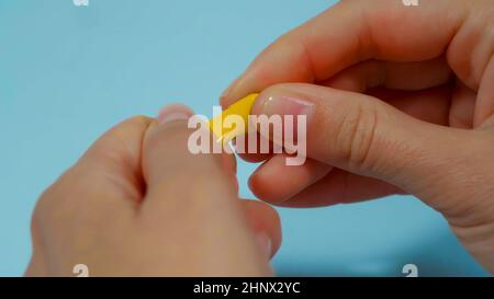 close up hand opening medicine capsule pill. Stock Photo