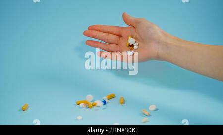 Hand Throwing Pills Away. Health Concept Stock Photo, Picture and Royalty  Free Image. Image 72740848.