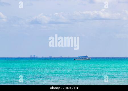 Boats and yachts between Cozumel island and the tropical mexican beach panorama view from Playa 88 and Punta Esmeralda in Playa del Carmen Mexico. Stock Photo