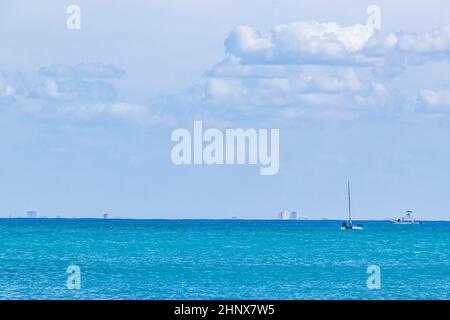 Boats and yachts between Cozumel island and the tropical mexican beach panorama view from Playa 88 and Punta Esmeralda in Playa del Carmen Mexico. Stock Photo