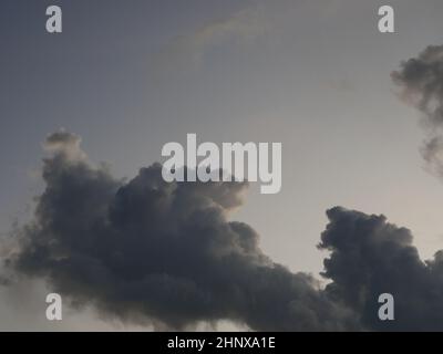 Cumulonimbus cloud formations on tropical sky , Nimbus moving , Abstract background from natural phenomenon and gray clouds hunk , Thailand Stock Photo