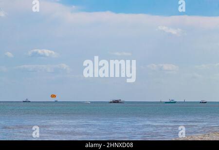 Boats and yachts between Cozumel island and the tropical mexican beach panorama view from Playa 88 and Punta Esmeralda in Playa del Carmen Mexico. Stock Photo