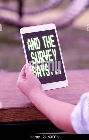 Writing displaying text And The Survey Says, Concept meaning written spoken results of short quiz or exam on internet Online Jobs And Working Remotely Stock Photo