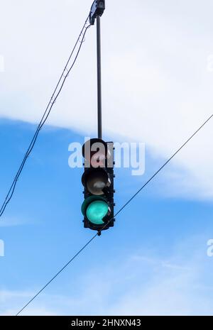 overhead traffic light under blue sky Stock Photo