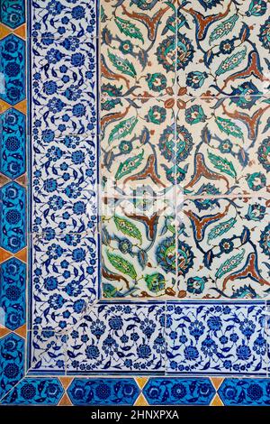 front view close up of Islamic ottoman era blue ceramic ornament tiles with flowers in Topkapi Palace museum Istanbul Stock Photo