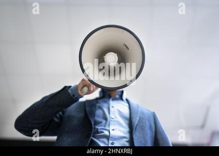 Megaphone Attention Concept. Man Shouting Using Loudspeaker Stock Photo