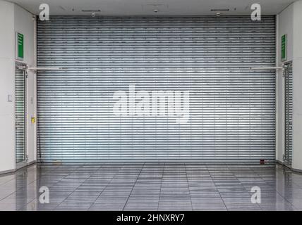 closed roller shutter at a shop without people Stock Photo