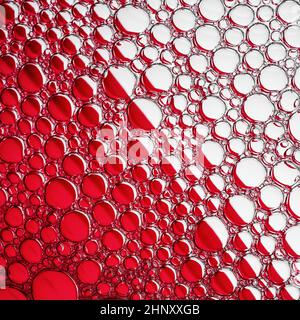 Abstract red bubbles texture. Foam bubbles macro background. Stock Photo