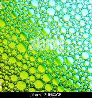 Green bubbles background. Foam bubbles macro texture. Stock Photo