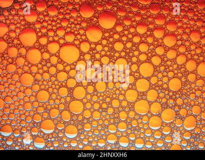 Orange bubbles background. Foam bubbles macro texture. Stock Photo
