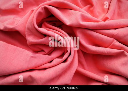 Rose gold fabric cloth texture for background and design art work, beautiful crumpled pattern of pink cotton . Stock Photo