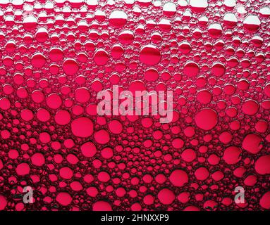 Red bubbles background. Foam bubbles macro texture. Stock Photo