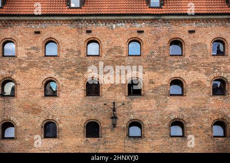 Facade of restored medieval granary on the Olowianka island in the old town of Gdansk Stock Photo