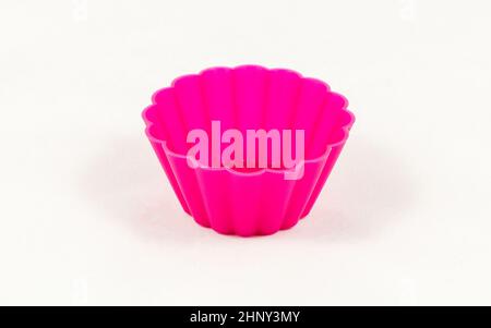 Pink silicone cake cups isolated on white background Stock Photo