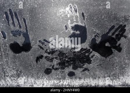 Handprints on frozen car window in the winter in Norway. Stock Photo