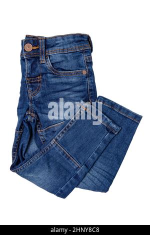 Jeans isolated. Folded trendy stylish blue denim stretch pants or trousers for child boy isolated on a white background. Clipping path. Jeans summer a Stock Photo