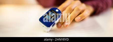 African Hand Pulse Heart Rate And Oximeter Stock Photo