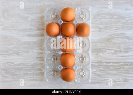 Chicken eggs laid out in the shape of a cross for the Easter holiday. Stock Photo