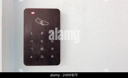 Electronic lock on the wall with copy space. Digital security systems for door security. Selective focus Stock Photo