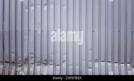 Old zinc abstract. Zinc vintage background view. crumpled metal plate of the fence. Tin roof background with a hole of rust and nails vintage style. Z Stock Photo