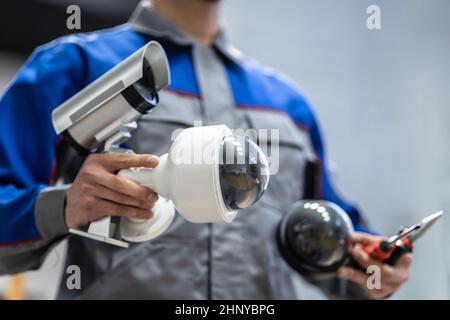 Technician Using Surveillance Security Camera Video System Stock Photo