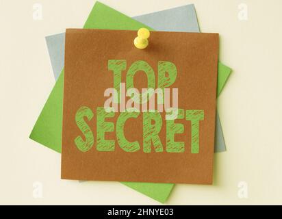 Text sign showing Top Secret, Business showcase protected by a high degree of secrecy Highly confidential Colorful Paper Notes Stacked Together And Pi Stock Photo