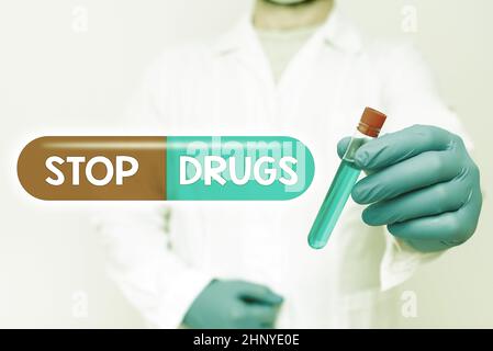 Conceptual display Stop Drugs, Business idea put an end on dependence on substances such as heroin or cocaine Doctor Analyzing New Medicine, Scientist Stock Photo