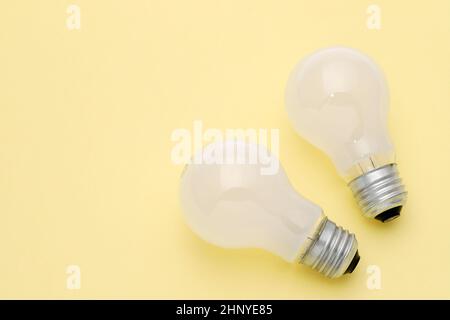 previously used the light bulb on yellow background Stock Photo