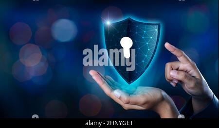Earth polygon mesh planet World Businessmen shake hands to protect information in cyberspace. Businessman holding shield protect icon protection netwo Stock Photo