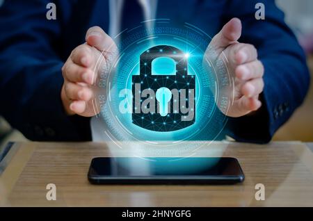 Unlocked smartphone lock Internet phone hand  press the phone to communicate in the Internet. Cyber security concept hand protection network with lock Stock Photo