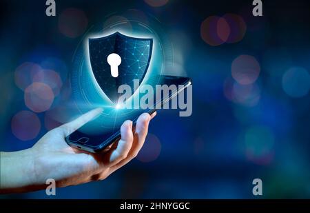 Shield Internet phone Smartphone is protected from hacker attacks, Firewall Businesspeople press the protected phone on the internet. space put messag Stock Photo