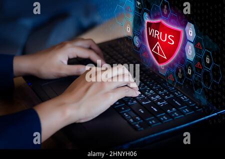 Press enter button on the keyboard computer Protective shield virus red Exclamation Warning Caution Computer in dark with word virus Stock Photo