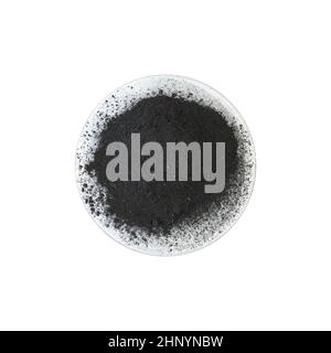 Carbon Charcoal Powder in Chemical Watch Glass. Close up chemical ingredient on white laboratory table. Top View Stock Photo