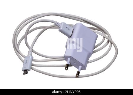 Closeup of a adapter charger with USB cable with Micro USB isolated on a white background. Macro photograph of a Smartphone or iphone battery charger. Stock Photo
