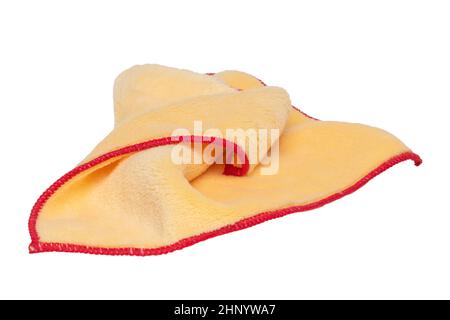 Household cleanliness and hygiene. Close-up of a yellow cleaning cloth isolated on a white background. Microfiber cleaning cloth. Macro. Stock Photo