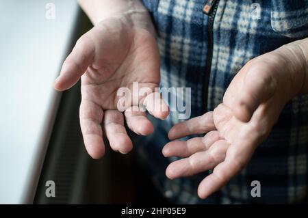Hands close up. Hands of a middle aged woman. Senior wrinkled skin Stock Photo