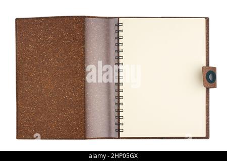 top view closeup of open notebook with metal spirals and brown cork hardcover blank pages isolated on white Stock Photo