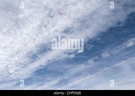 Stunning mixed cloud formation panorama in a deep blue summer sky. Stock Photo
